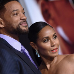 Пара на фоні червоного килима