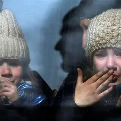 Zelensky examines a map of the war