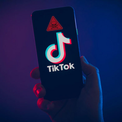 Пиктограмма TikTok на опасном фоне