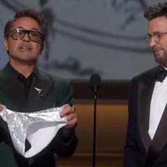 Robert Downey Jr. presents Chris Evans with silver thong on stage