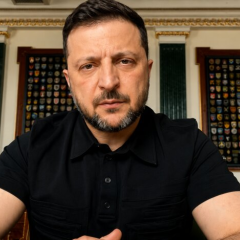Volodymyr Zelensky reviewing documents