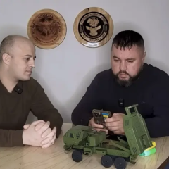Russian soldier with a phone in hands