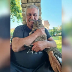 Vasyl Shklyar with his cat at home
