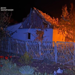 Damaged houses and gas station from air strike