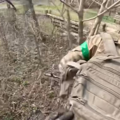 Injured fighter being evacuated under fire