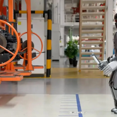 Robots replacing humans at car factory