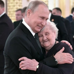 Putin and the teacher at the parade in the Kremlin