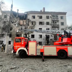 Injured and deceased person under rubble