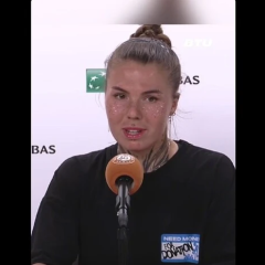 Ukrainian tennis player reads address after the match