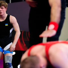 Wrestler turned his back to the flag