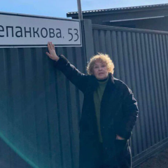 Ada Rogovtseva near the sculpture of a man