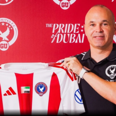 Iniesta in coaching uniform on stadium
