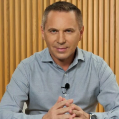 Photo of linguist Avramenko with microphone
