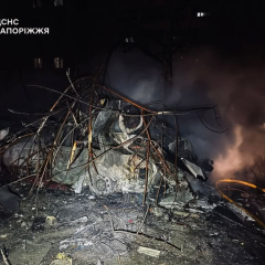 Injured person, burnt cars, and damaged houses