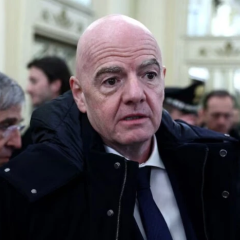 FIFA President Gianni Infantino on a football field background