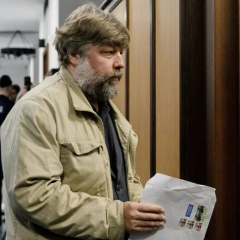 Archaeologist in front of Ukrainian flag