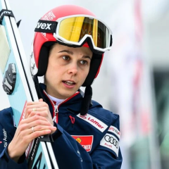 Lisa Eder with Austrian flag in the background