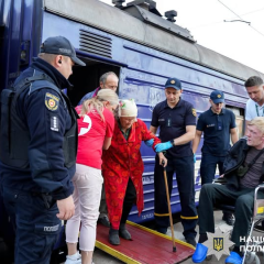 Group of elderly passengers at the station
