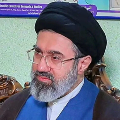 New leader of Iran with raised finger