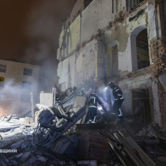 Bodies of a boy and a woman under the rubble