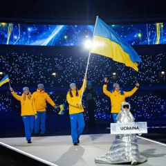 Russian woman holds sign saying Ukraine
