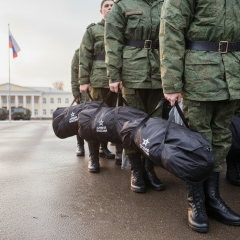 Students in military uniform in front of university
