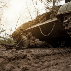 Soldier covers hole from a bullet