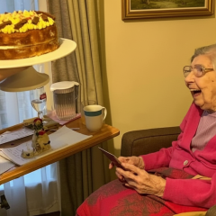 Centenarian British woman smiling in photo