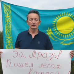 Activist with poster and Ukrainian flag