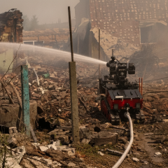 Rescuers train robot to extinguish shelled fire
