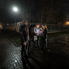 Kyiv resident listens to the message on the equipment