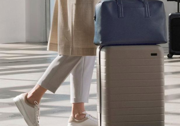 Passenger indicating address on luggage