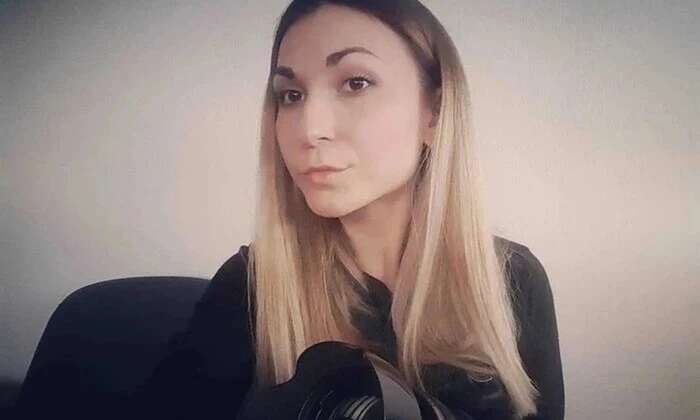 Girl in a red dress with a medal