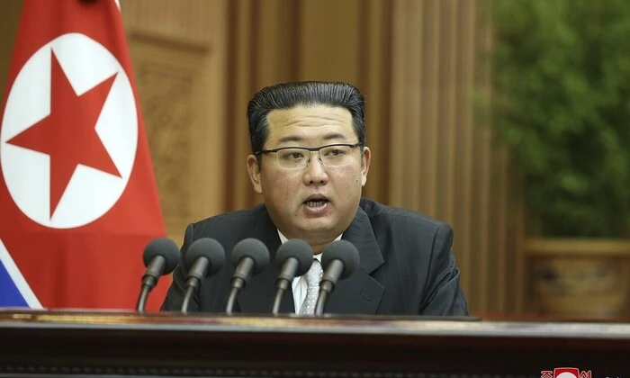 Portrait of Kim Jong Un with nuclear symbolism