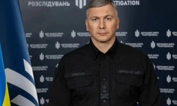 Эмблема полка Скеля на фоне текста