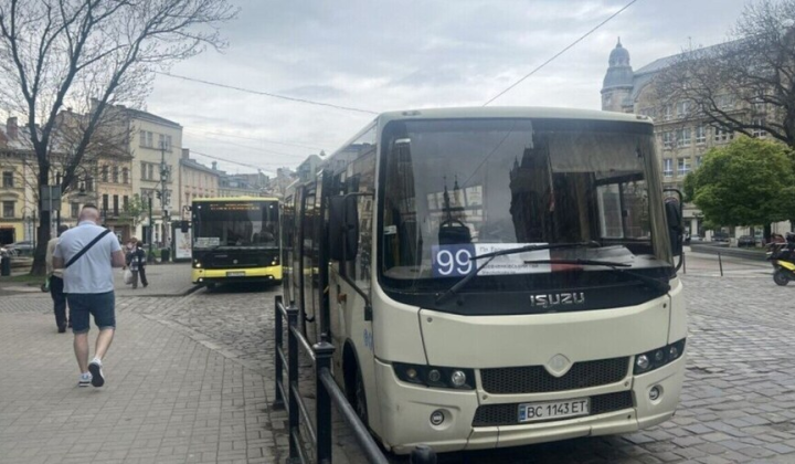 A white bus No. 99 stands in the center of Lviv
