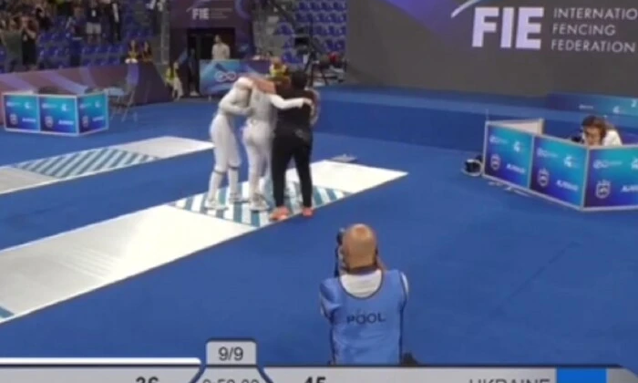 Ukrainian fencers celebrate victory over the Russians