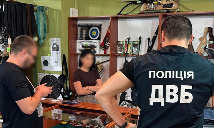 A woman was selling weapon permits