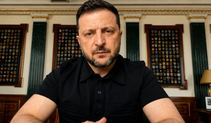 Volodymyr Zelensky reviewing documents