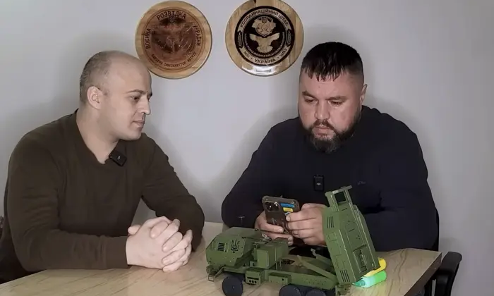 Russian soldier with a phone in hands