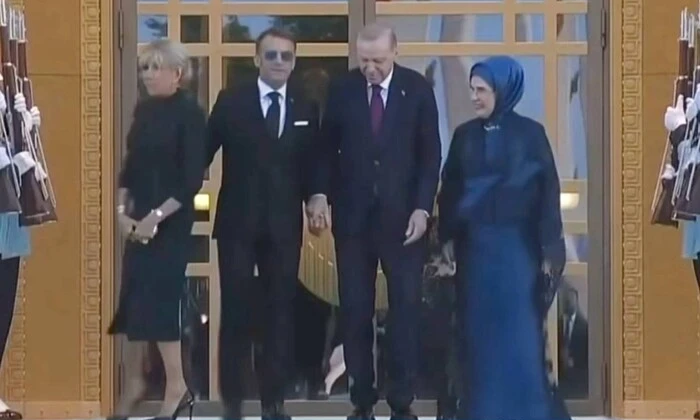 First lady takes back president's hand