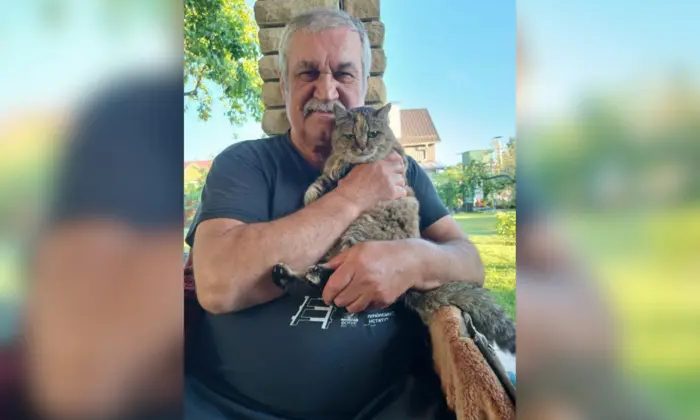 Vasyl Shklyar with his cat at home