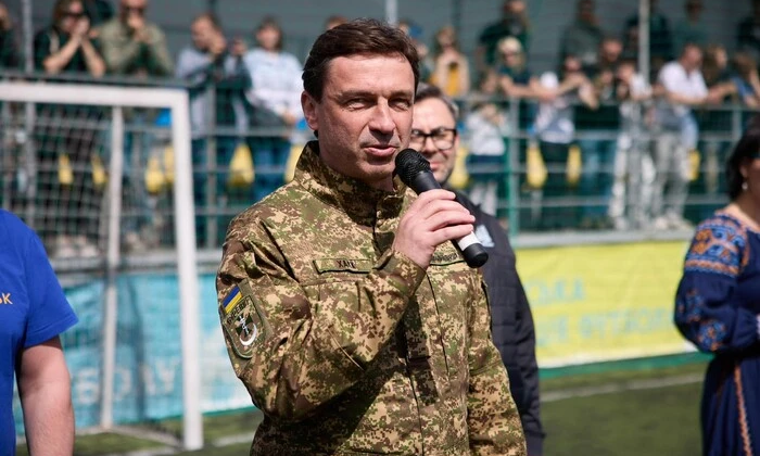 Vaщоuk's son with a ball in the background