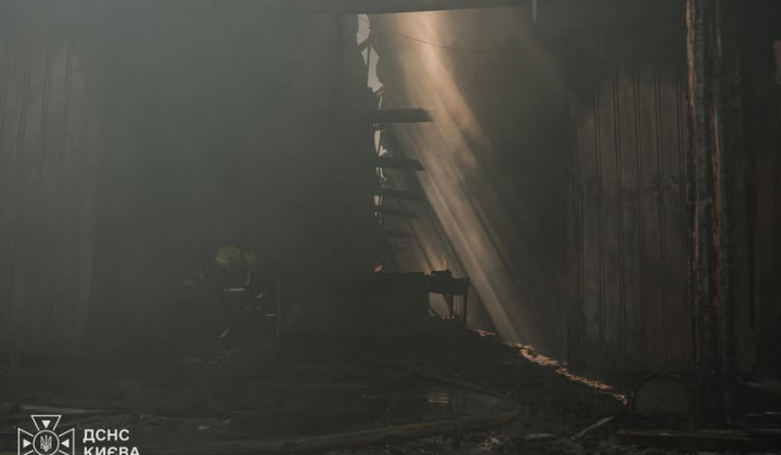 Rescuers extinguishing smoldering in Kyiv