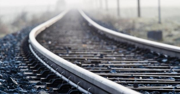 Passenger train travels on the railway