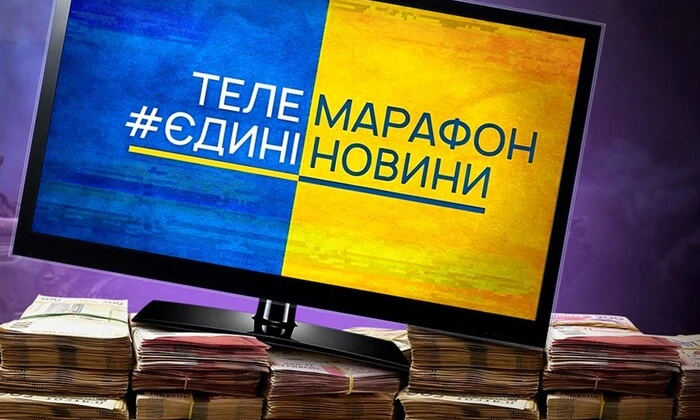 Логотип ЦВК на фоні моніторів