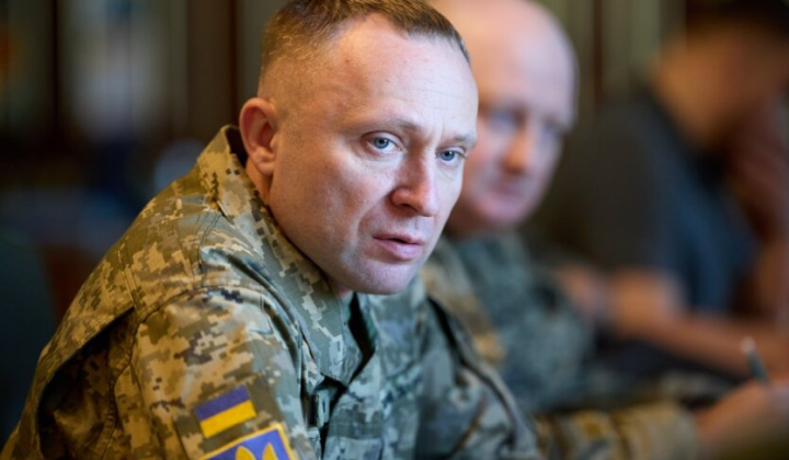 Zelensky reviews military uniform documents