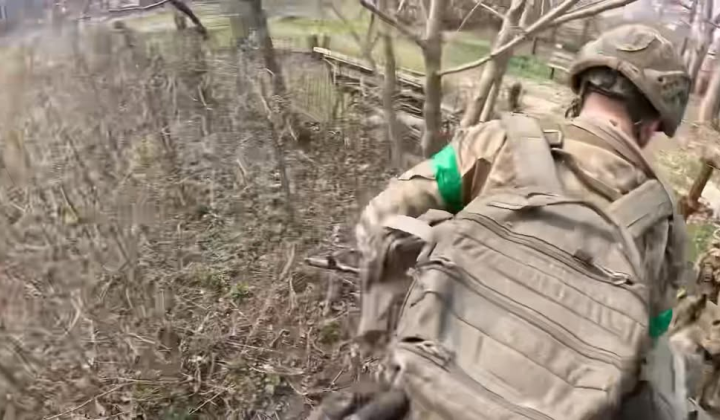 Injured fighter being evacuated under fire