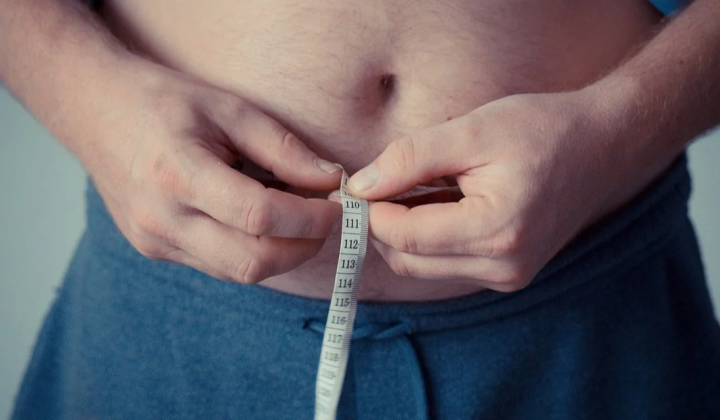 Two opposite weight loss bottles on scales