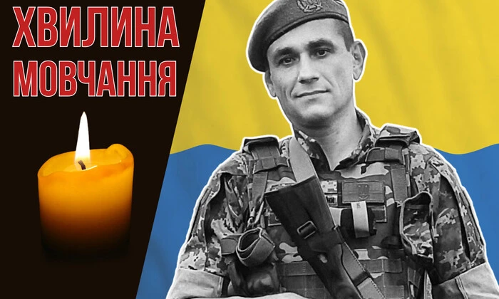 Дизайнер Вадим Балановский с памятной монетой